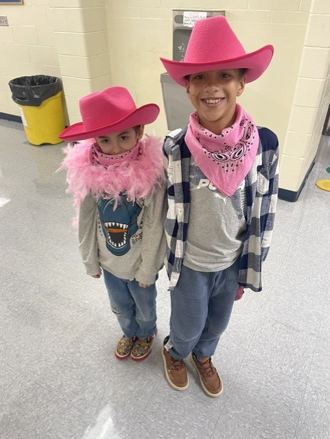 Students wear pink cowboy hats during Dolly Day at Northwest Center for Autism at High Road School