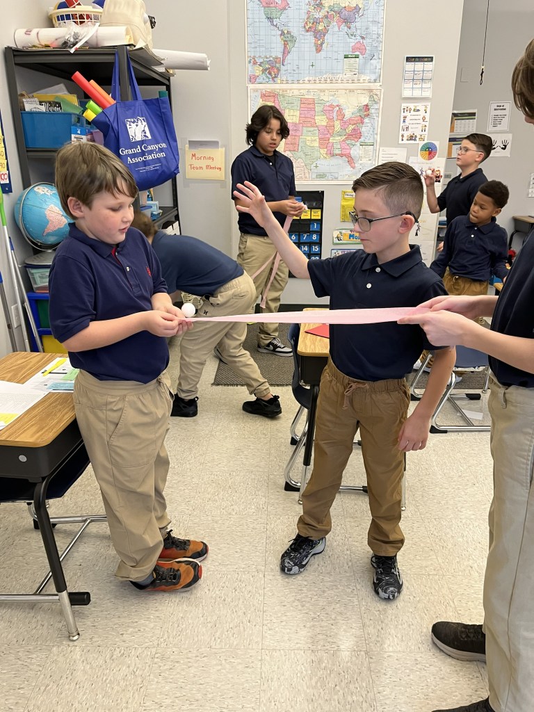 High Road students working together during a classroom team-building activity