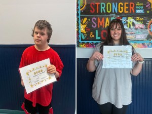 Jacob P. and Landry Howland hold their Student and Staff of the Week certificates at High Road School of Boone County.