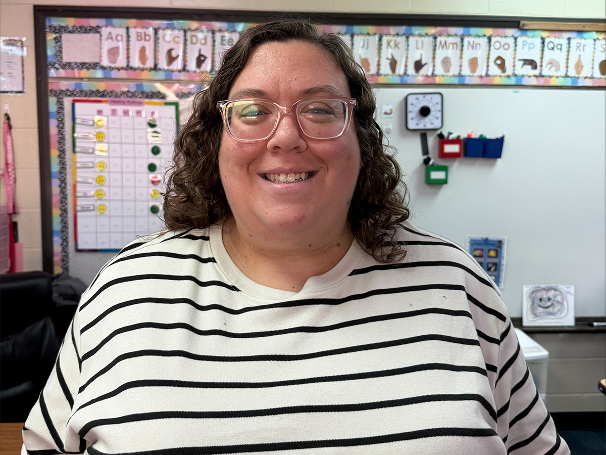 Jodi Coy, a special education teacher at Northwest Center for Autism, standing in a classroom.