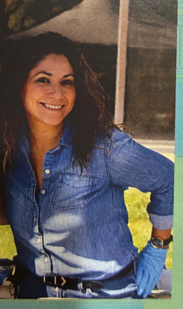 NewHope Academy educator posing in a classroom