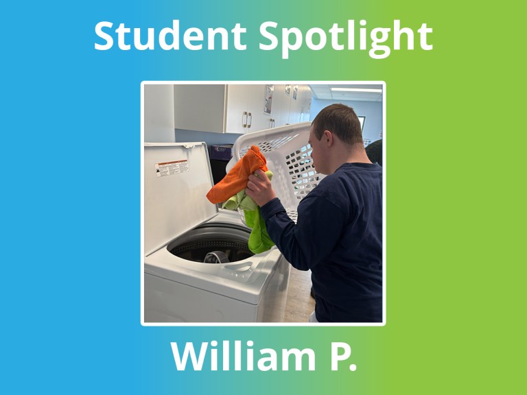 William completing a laundry task during a student learning activity at High Road School of East York.