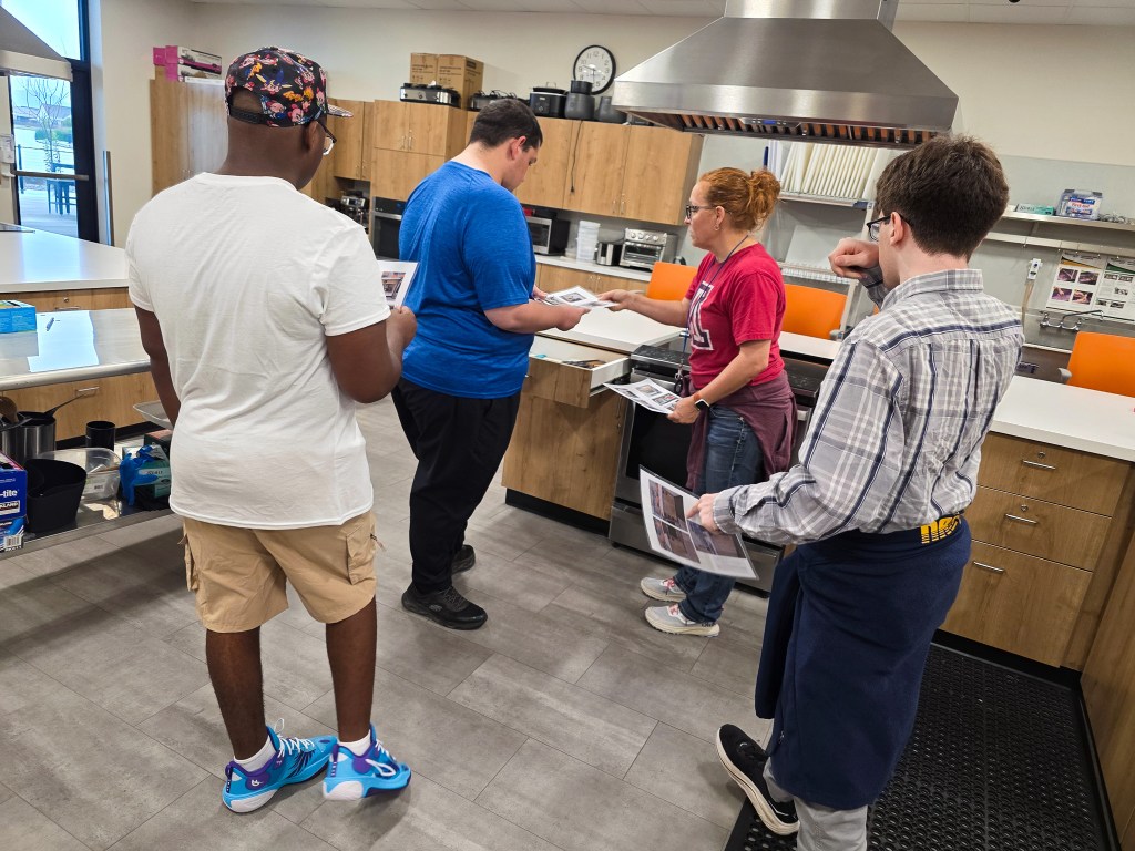 Sierra School of Gateway students practice workplace skills in a teaching kitchen during work-based learning.