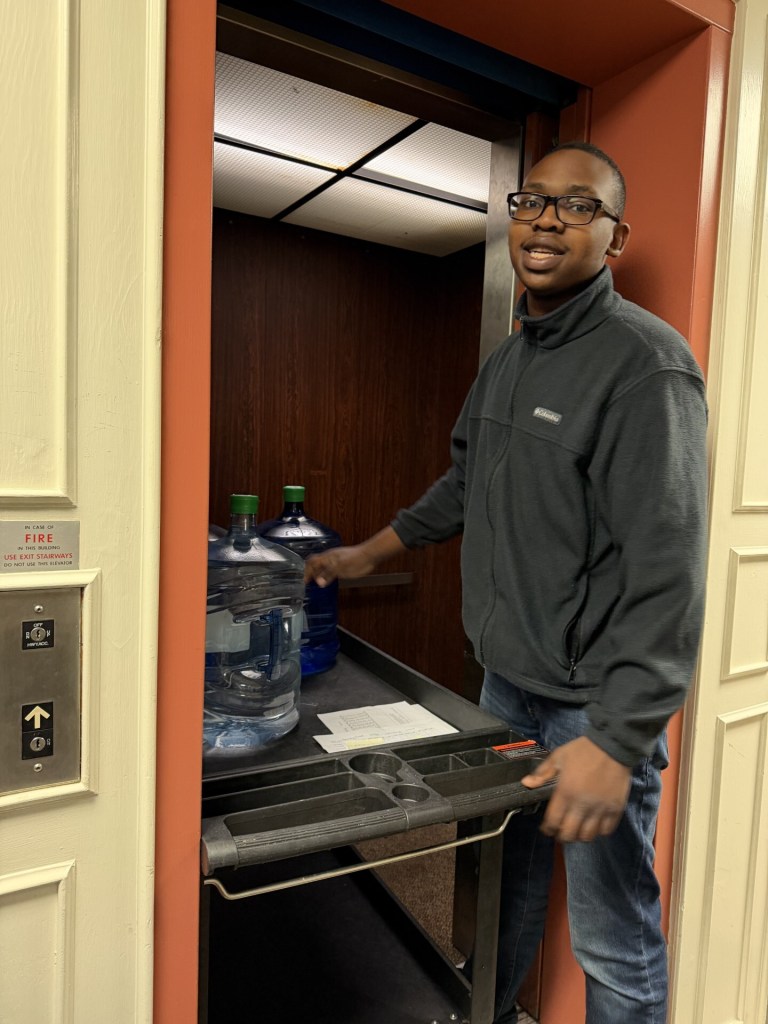 Oliver participating in a food service activity at High Road School of Massachusetts.