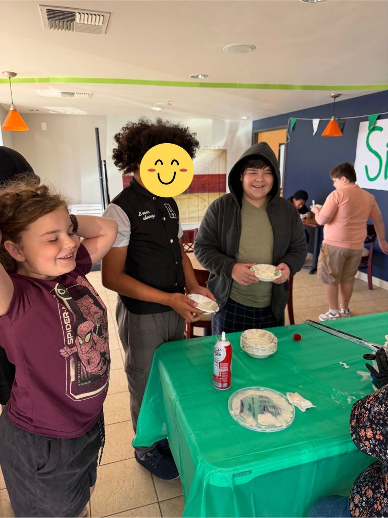 Sierra School of Solano County students gather around the activity table during the Quarterly Admin Event.