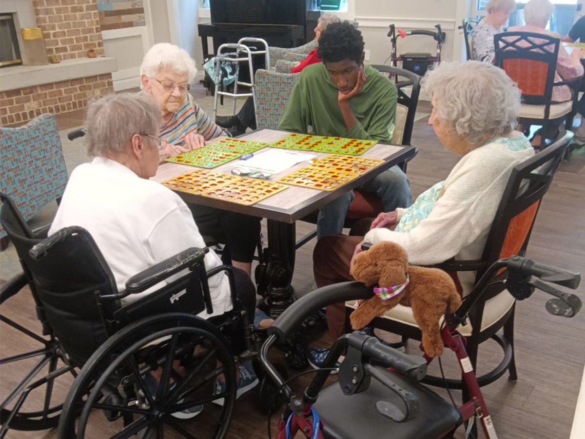 1. High Road School of Baltimore County student spending time with Oak Crest residents during a community service visit.