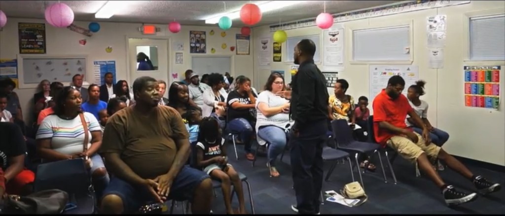 Carl Blackmon speaks to students and families gathered at High Road School of Santa Rosa.