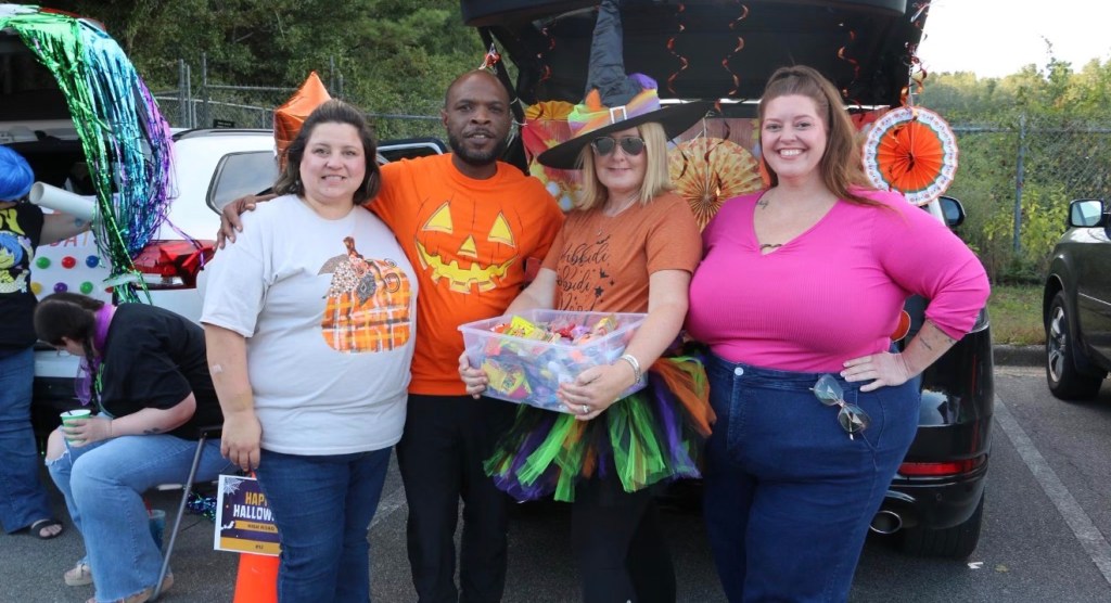 Carl Blackmon joins High Road School of Santa Rosa staff during a community event.