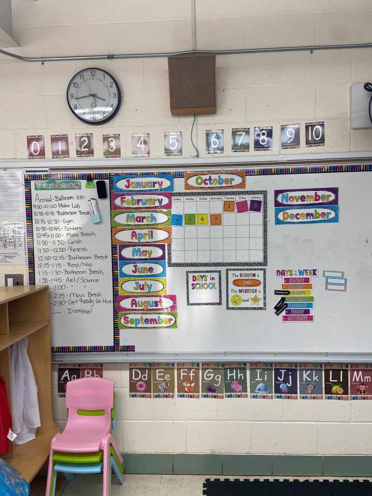 Calendar, daily schedule and educational displays inside the early childhood special education classroom.