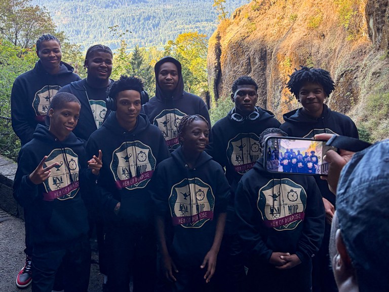 Men of Purpose students, including members of the Excel Academy of Englewood community, posing together during their Portland trip.