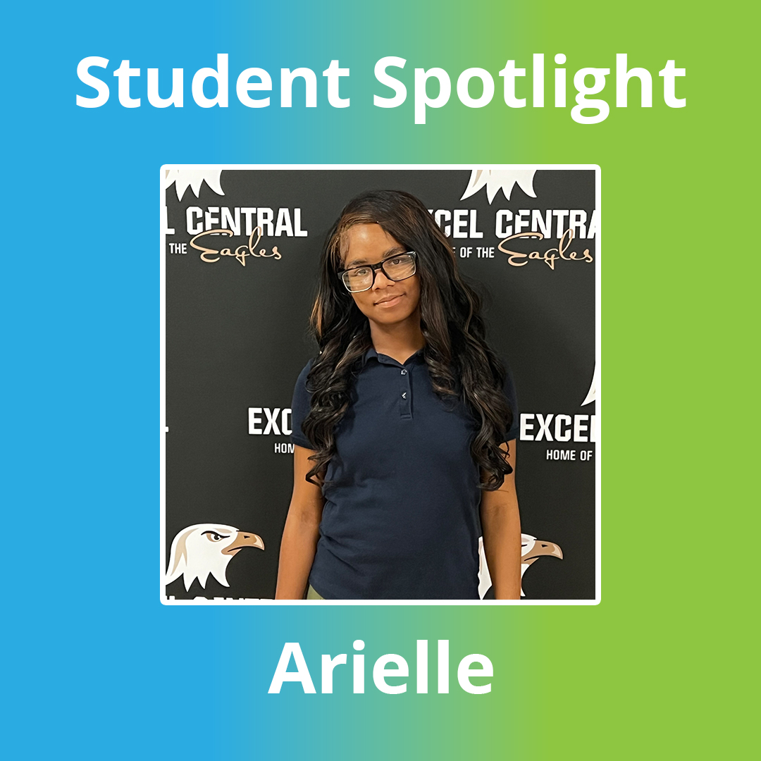 Excel Academy Central senior Arielle Johnson poses in front of an Excel Central Eagles backdrop, wearing a navy polo shirt and glasses.