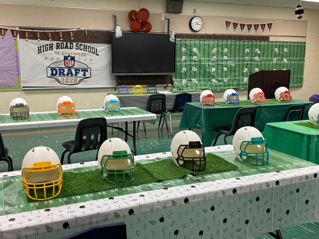 High Road School of Belvidere classroom decorated with football helmets, field-themed tables and an NFL Draft display.