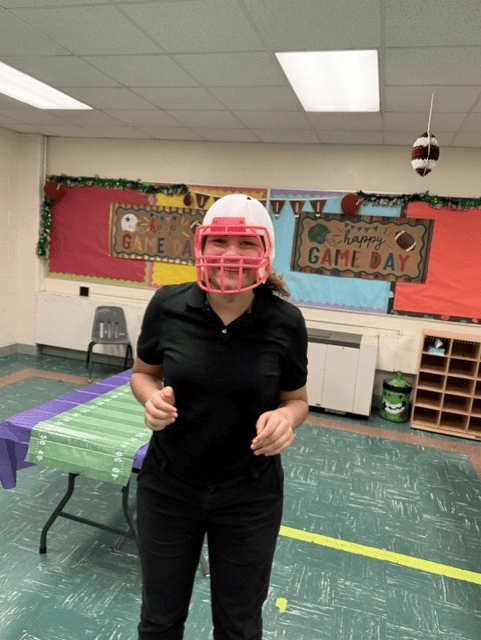 High Road School of Belvidere student wearing a football helmet during an NFL-themed classroom activity.