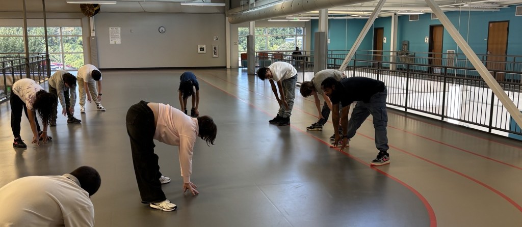 High Road School of Nashville students stretching together during a visit to the Southeast Community Center.