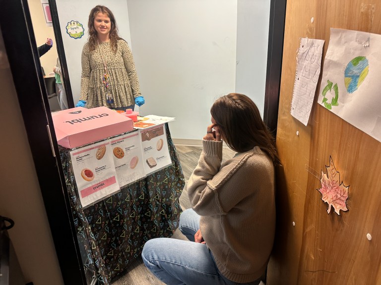 High Road School of Wright City staff member serving Crumbl cookies during the Pick-Me-Up Cart.