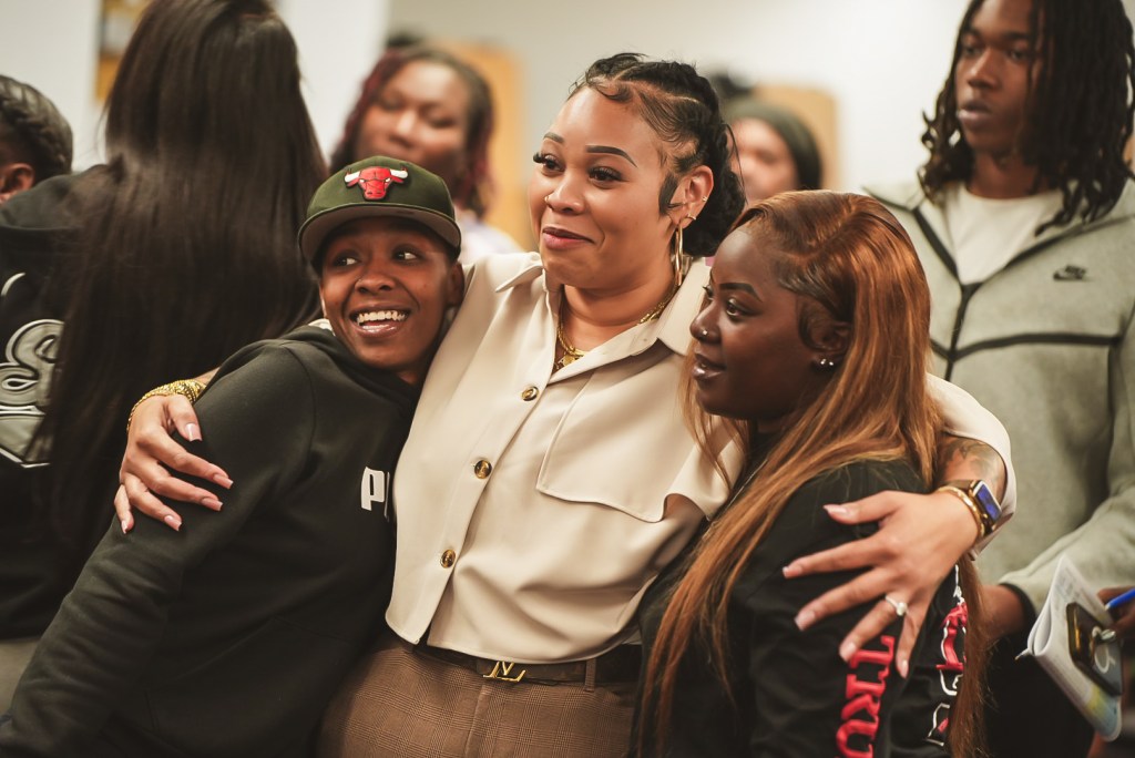 Excel Academy of Roseland staff and students connecting during the State of the School Address.