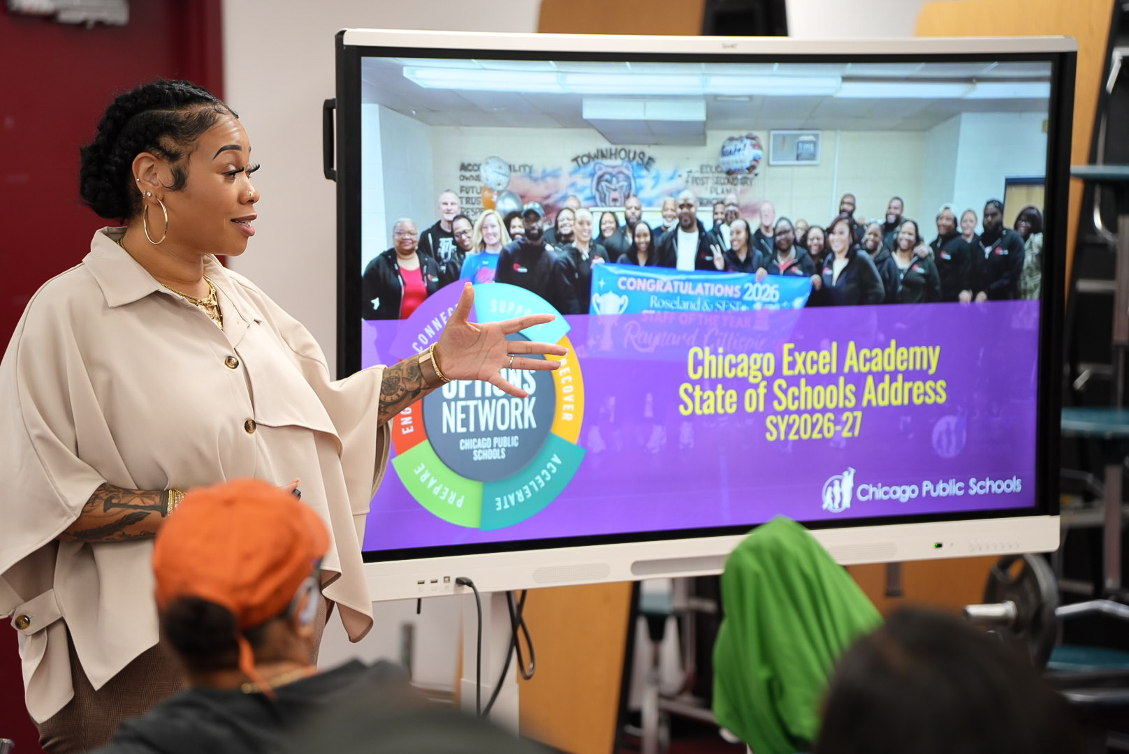 School leader presenting during Excel Academy of Roseland’s State of the School Address.