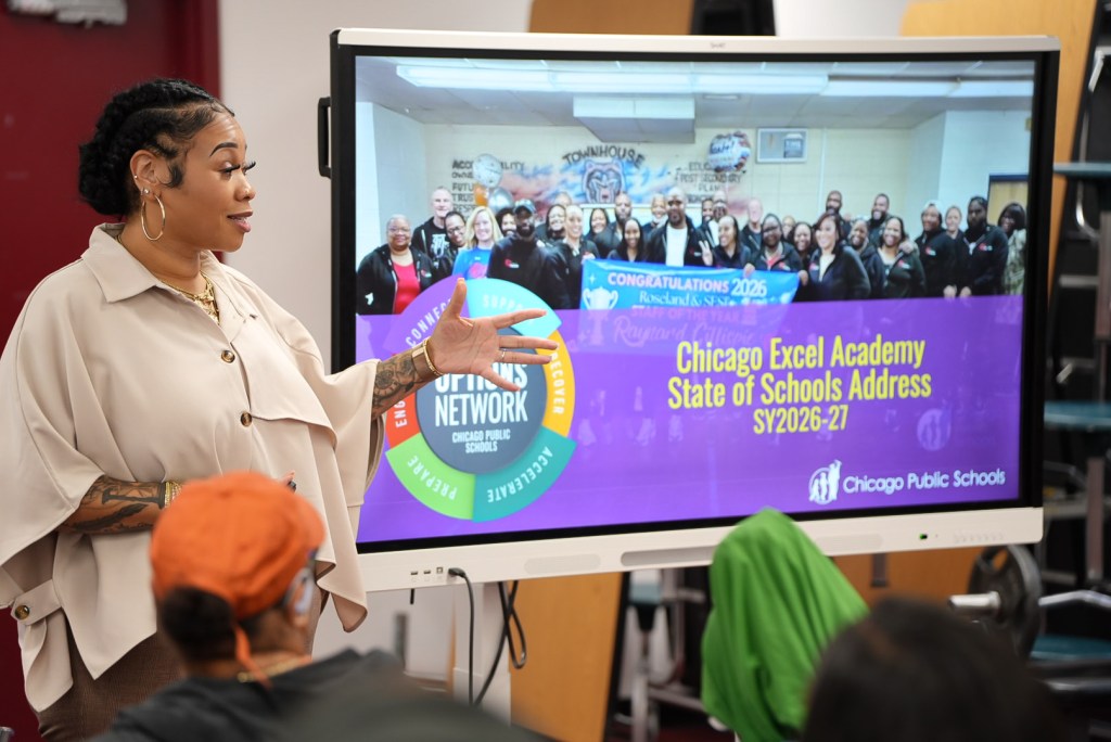 School leader presenting during Excel Academy of Roseland’s State of the School Address.