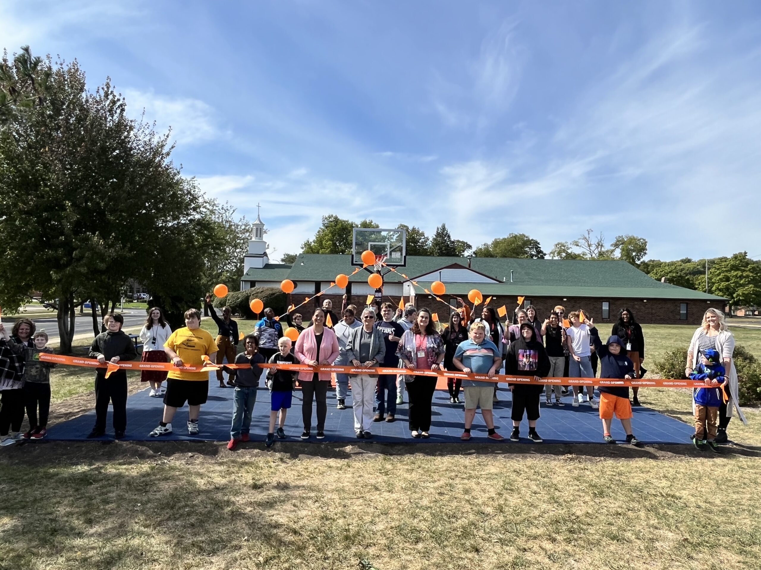 Ribbon cutting ceremony for the new sport court