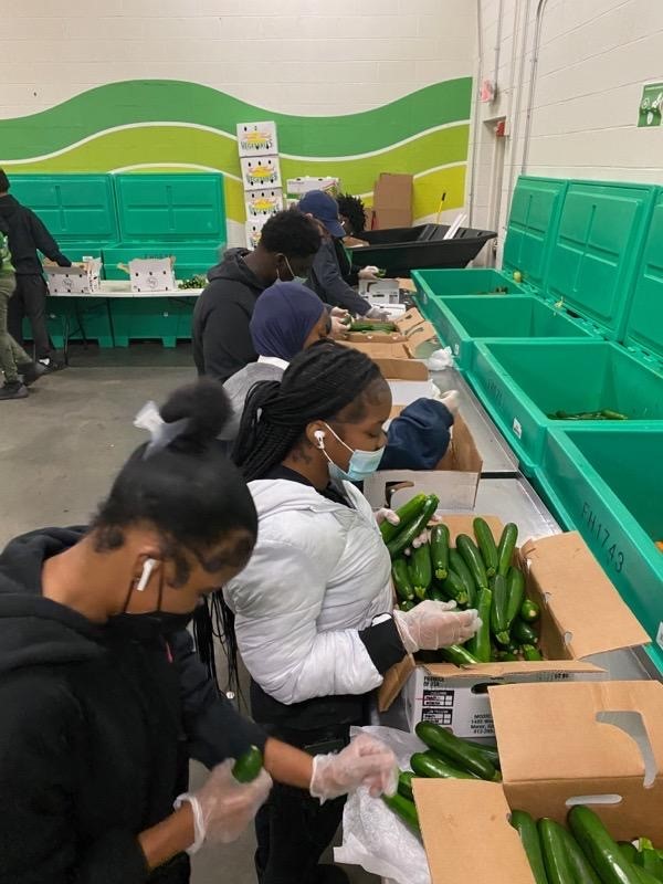 Excel Academy North students helping out