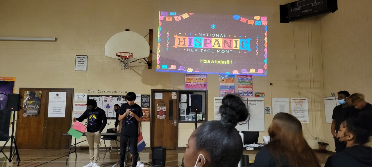 Students presenting Hispanic Heritage Month projects - Photo 1