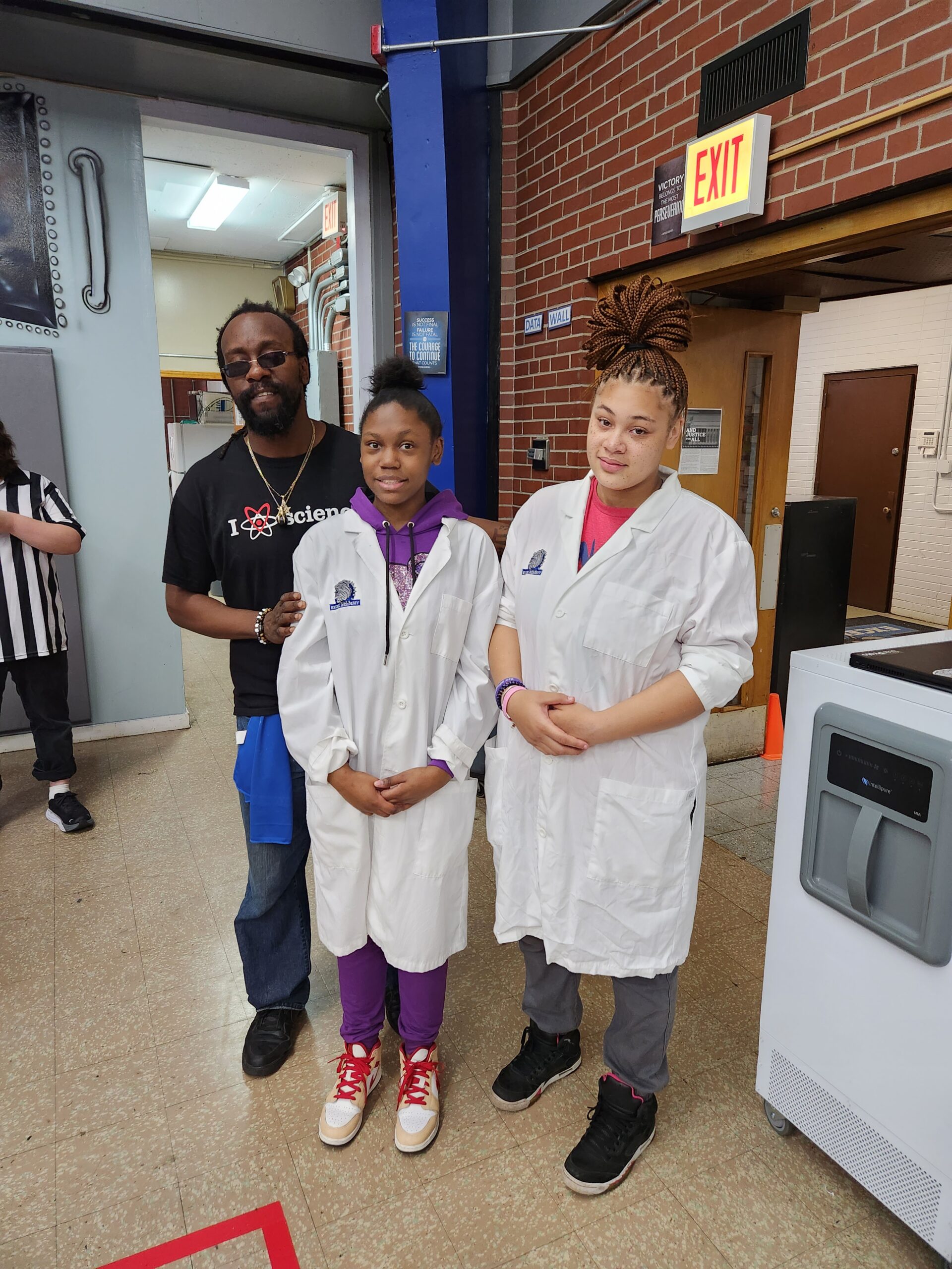 Excel Academy students working on robotics projects