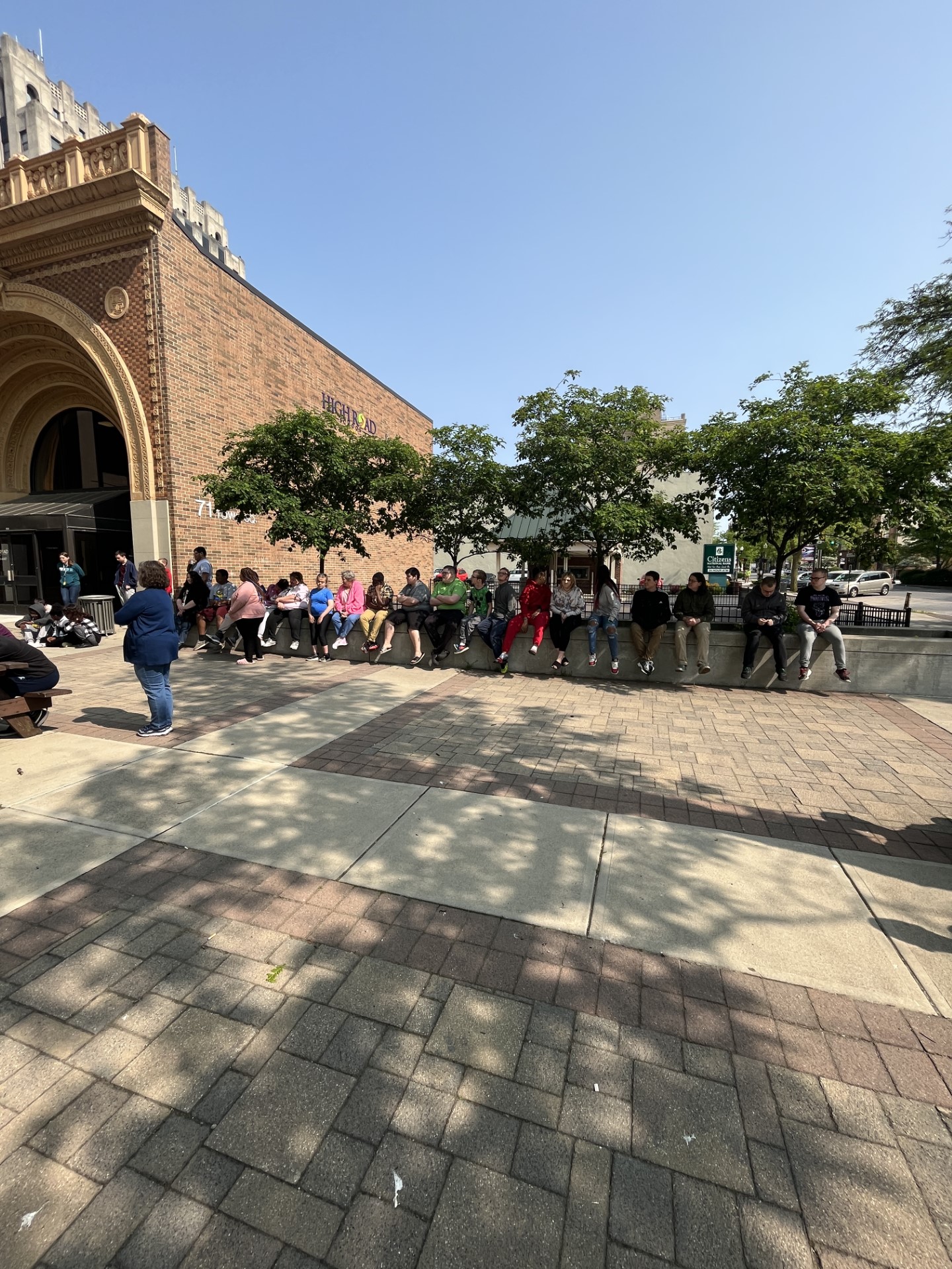Students playing ukuleles downtown