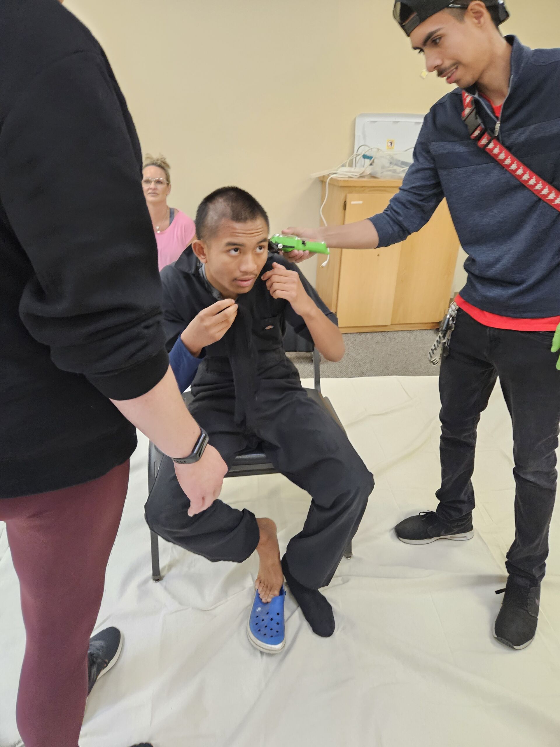 Students receiving haircuts - Image 6