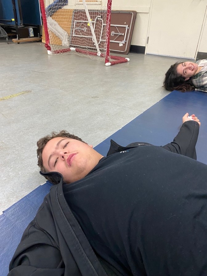 Students engaging in midweek stretching - Image 2