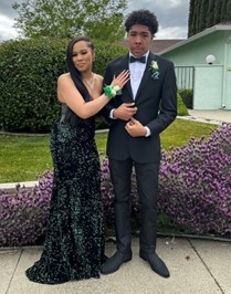 Janae poses with her date for her senior prom