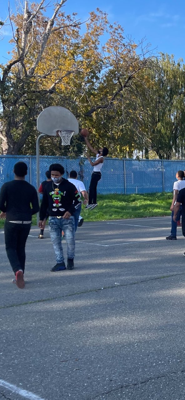 Students engaged in a basketball game
