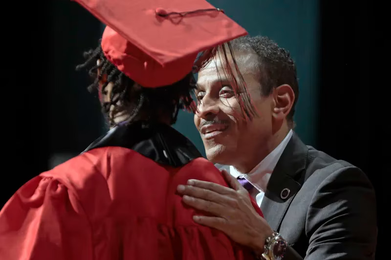 Superintendent Tony B. Watlington congratulating a graduate