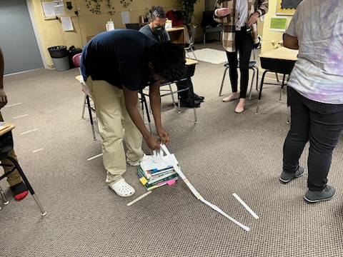 Students working on kinetic energy ramps - Image 4