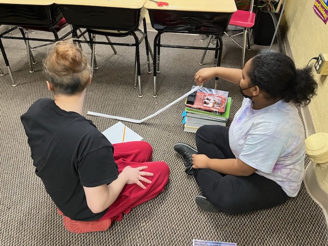 Students working on kinetic energy ramps - Image 2